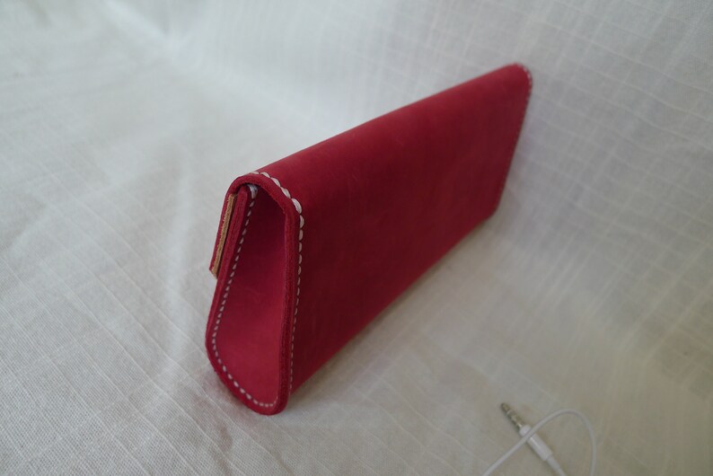 Distressed leather clutch with magnetic button snaps