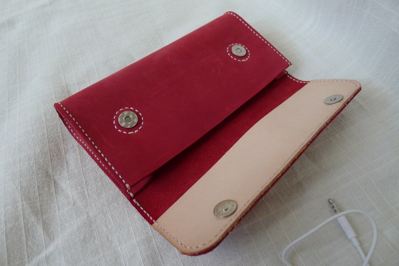 Distressed leather clutch with magnetic button snaps