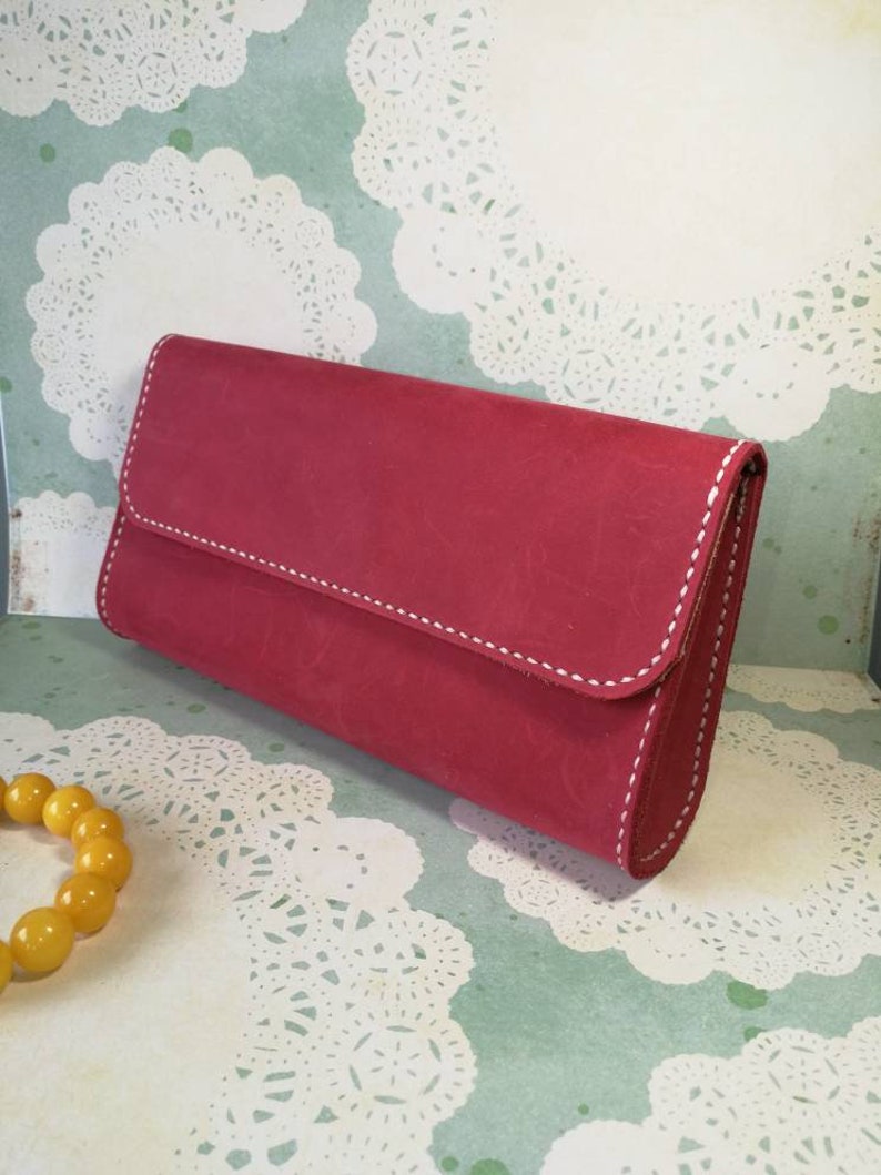 Distressed leather clutch with magnetic button snaps