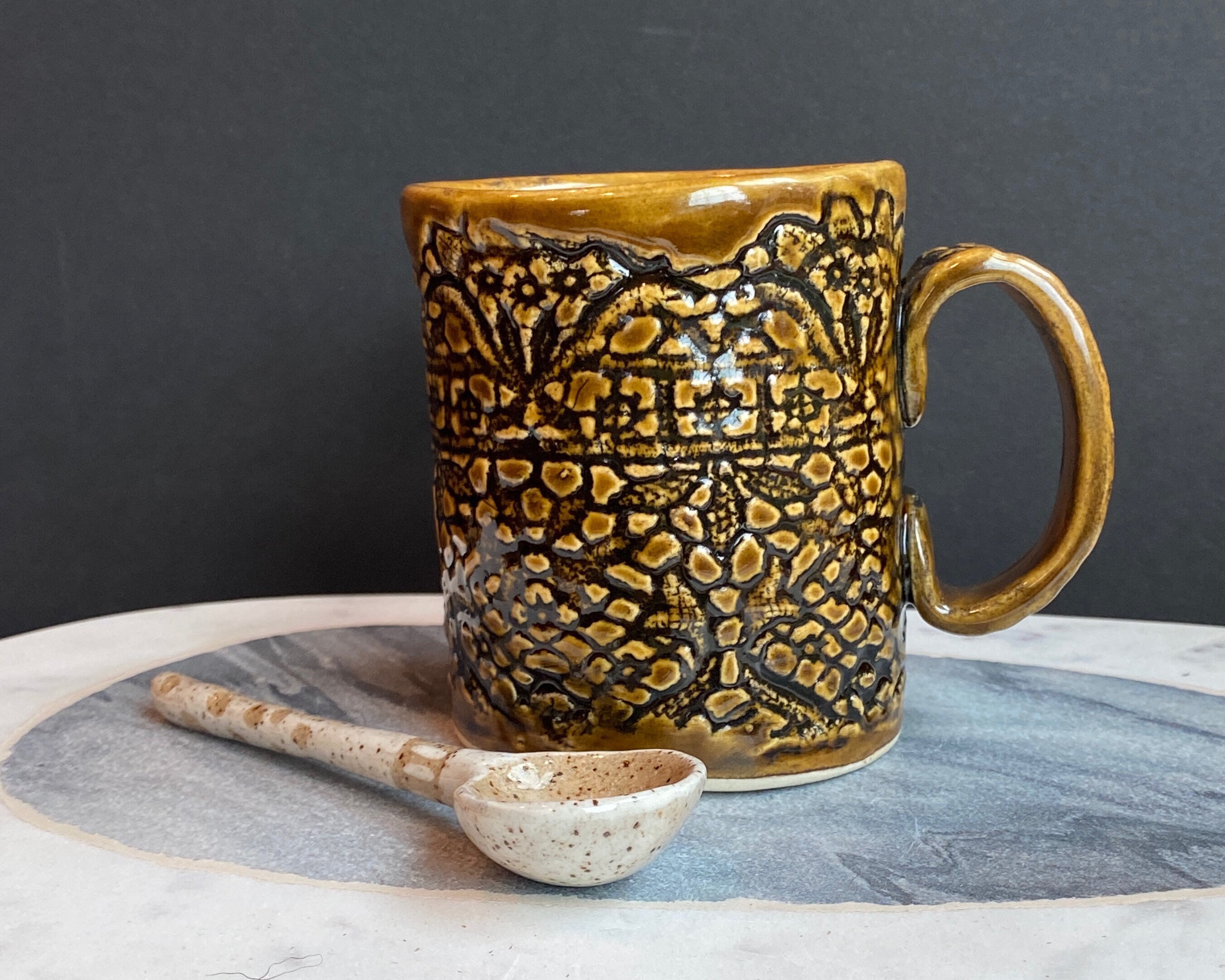 Hand build stoneware white clay, lace motif pattern mug, iron color glaze