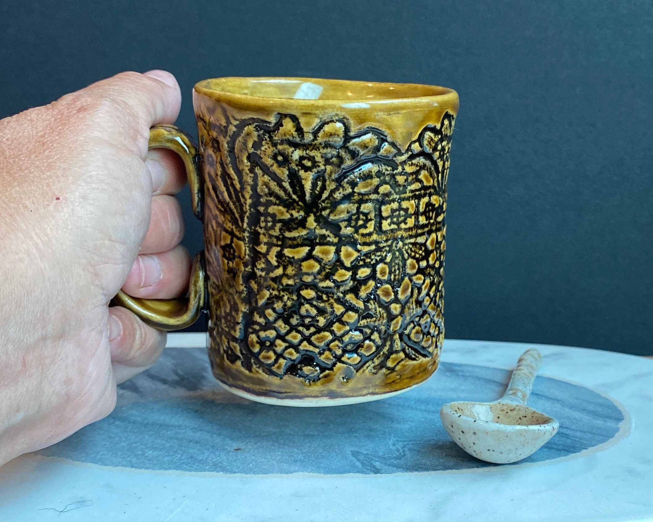 Hand build stoneware white clay, lace motif pattern mug, iron color glaze
