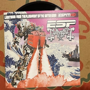 May include: A black vinyl record with a pink and white album cover. The cover features a robot illustration with a cityscape and ocean wave design. Text on the cover includes "Livestream From The Flashpoint Of The Water Wars" and "ESP Mayhem".