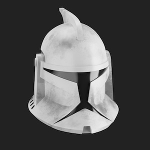Puede incluir: Un casco de soldado clon blanco de plástico con un acabado desgastado y envejecido. El casco tiene una visera negra y una cresta distintiva en la parte superior.
