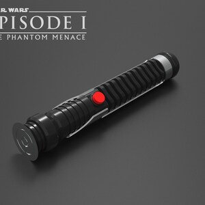 May include: A black lightsaber with a red button and a silver accent. The lightsaber is from the Star Wars Episode I: The Phantom Menace movie.