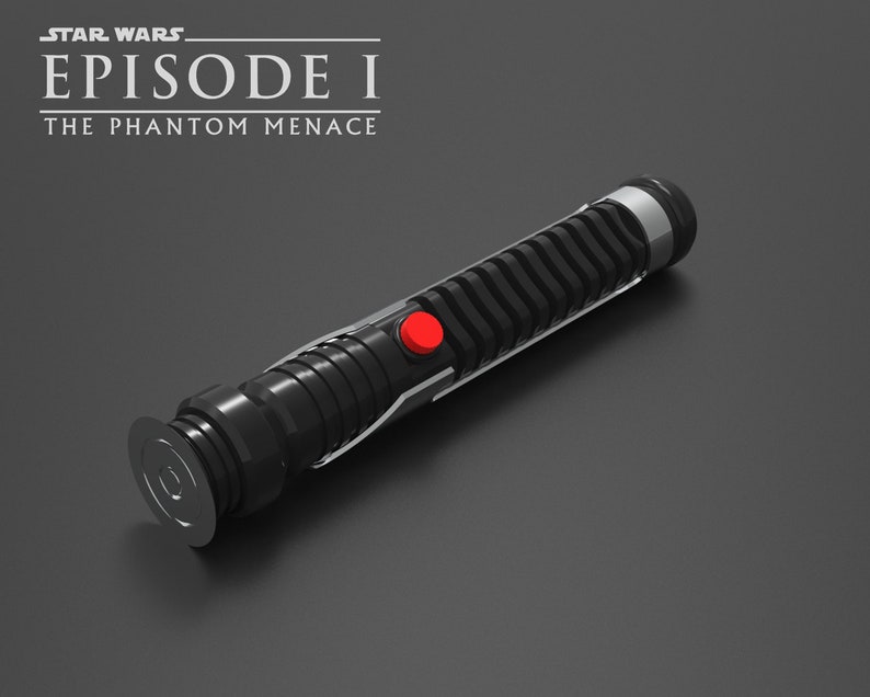 May include: A black lightsaber with a red button and a silver accent. The lightsaber is from the Star Wars Episode I: The Phantom Menace movie.