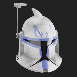May include: A white and blue Star Wars clone trooper helmet with a weathered finish. The helmet has a blue visor and a black stripe across the front. There is a small antenna on top of the helmet.