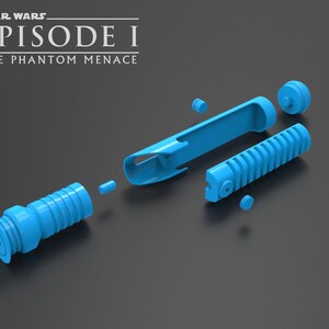 May include: A disassembled blue lightsaber from Star Wars Episode I: The Phantom Menace. The lightsaber is made up of several pieces, including the hilt, the blade, and the emitter.