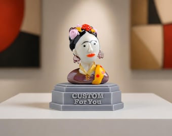 May include: A decorative bust of a woman with a floral headdress, earrings, and a yellow shawl with red polka dots. The bust is on a grey pedestal with the text "CUSTOM For You".
