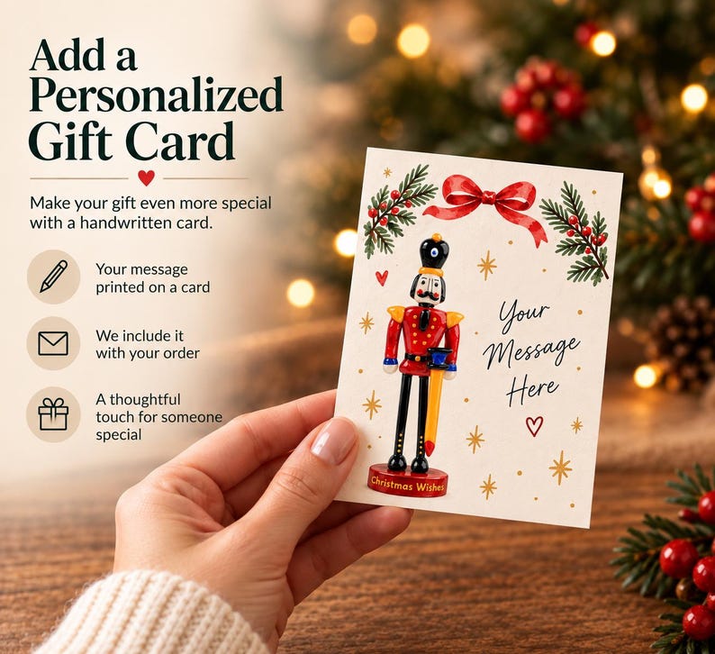 Gift card of the Nutcracker's long black glass legs and shoes, standing securely on the round red display base.
