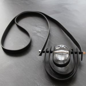 Black rubber  long  avantgarde necklace with clear lucite large bead