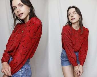 80s Red blouse with puff sleeves and abstract pattern