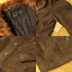 May include: Brown suede jacket with a fur collar and button closure. The jacket has a quilted lining and a label that reads "suede & leathercraft limited". The jacket is a vintage style.