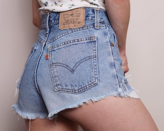 Vintage Levis 891 02 shorts size W28, Light blue denim, Frayed and distressed