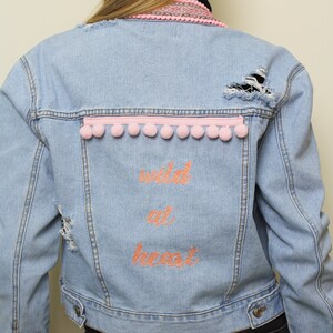 Embroidered denim jacket with pom poms and aztec ribbon trim, Embellished jean jacket