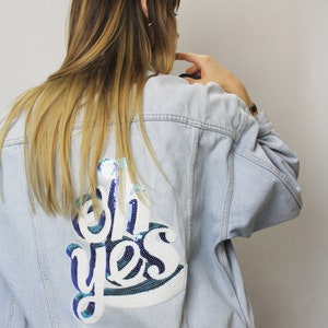 Sequin denim jacket with patch on the back