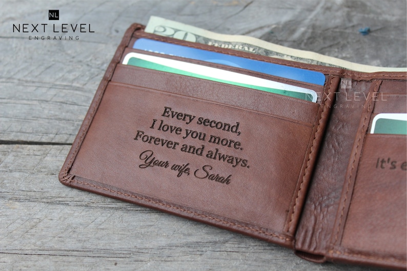 May include: A brown leather wallet with a personalized inscription that reads "Every second, I love you more. Forever and always. Your wife, Sarah".