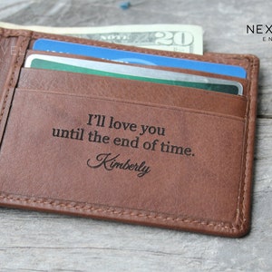 May include: A brown leather wallet with a personalized inscription that reads "I'll love you until the end of time. Kimberly".