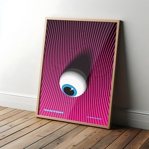 May include: A framed poster with a pink and black striped background. A large white eye with a blue iris is centered on the poster. The text "Crazy Rippers" is at the bottom of the poster.