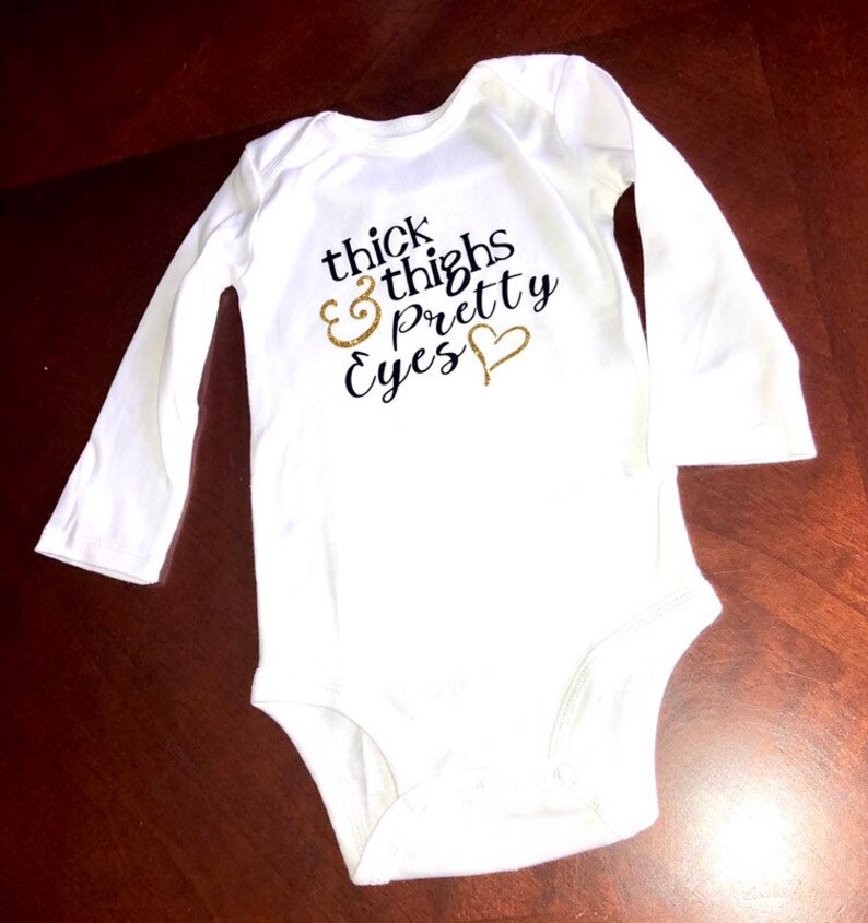 thick thighs and pretty eyes onesie