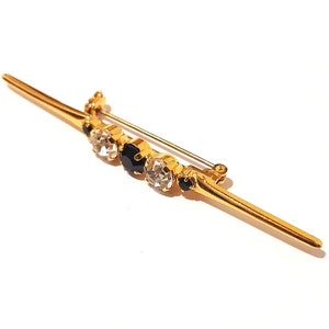 Retro rhinestone and gold metal brooch