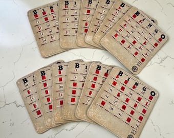 Lotto di 12 cartelle da bingo vintage Pla-Mor King, riutilizzabili, con finestra scorrevole.