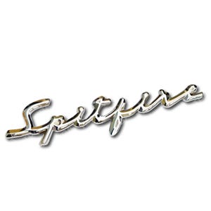 May include: A chrome-plated metal emblem with the word "Spitfire" in a stylized script font.