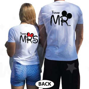 May include: White t-shirts with black text and Mickey Mouse ears. The text on the shirts reads "Future Mr." and "Future Mrs."