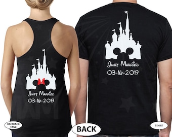 May include: A black tank top and t-shirt with a white silhouette of Cinderella's castle and Mickey Mouse ears. The text "Just Married" and a wedding date are printed below the castle. The tank top has a red bow on Mickey Mouse's ear.