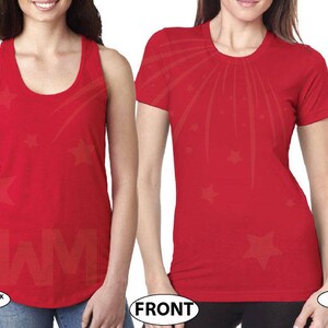 May include: Two red shirts with a starburst design. The shirt on the left is a tank top and the shirt on the right is a t-shirt.