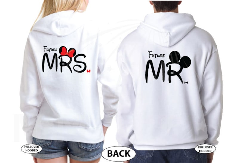 May include: White hooded sweatshirts with the text "Future Mrs." and "Future Mr." in black with a Mickey Mouse head silhouette. The "Mrs." has a red bow and the "Mr." has black ears.