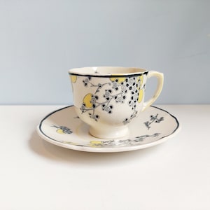 Vintage Royal Doulton "Carnival" series demitasse teacup and saucer, made in England 1930s