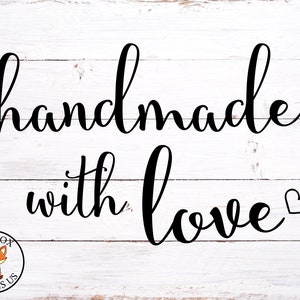 May include: White wood sign with black script lettering that reads "handmade with love" and a small heart.