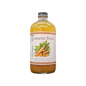 May include: A clear glass bottle filled with a yellow turmeric tonic. The label features the text Turmeric Tonic, With Ginger, Lemon, Black Pepper and Apple Cider Vinegar, and 16 OZ, along with an illustration of turmeric roots and green leaves.
