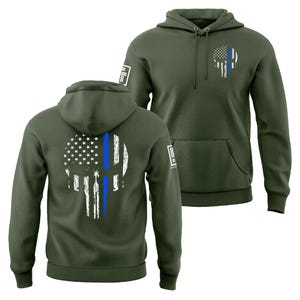 May include: Olive green hoodie featuring a distressed skull design with a blue line and American flag elements. The hoodie has a front pocket, a hood, and a logo on the sleeve. The design is on the front and back.