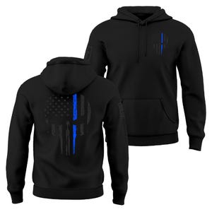 May include: Black hooded sweatshirts with a front pocket and drawstring. The sweatshirts feature a distressed skull design with a blue line and American flag elements. The design is on the front and back of the sweatshirts.