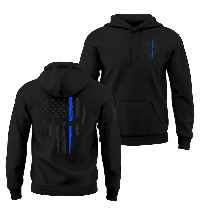 May include: Black hooded sweatshirts with a front pocket and drawstring. The sweatshirts feature a distressed skull design with a blue line and American flag elements. The design is on the front and back of the sweatshirts.