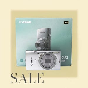 Excellent état ! Canon Ixus 145 / Powershot ELPH 135 / Ixy 120 gris avec boîte - Appareil photo numérique vintage. Appareil compact. Testé.