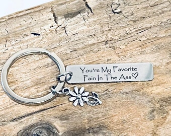 You’re My Favorite Pain In The Ass, Custom Engraved Stainless Steel Rectangle Charm, Silver Tone Flower Charm, on a Silver Tone Keyring J698