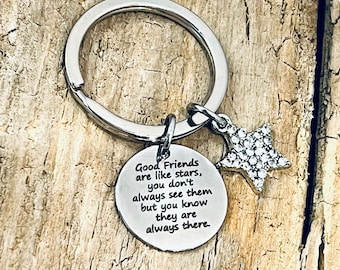 May include: Silver keyring with a star charm and a round tag that reads "Good Friends are like stars, you don't always see them but you know they are always there."