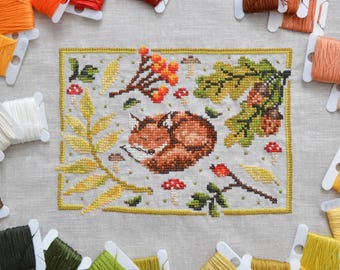 Patrón de punto de cruz en PDF: Zorro durmiendo en el bosque.