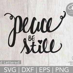 May include: Hand-lettered design with the text "peace be still" in black on a woodgrain background. The design includes a small heart symbol. The text is available as a digital download in SVG, DXF, EPS, and PNG formats.