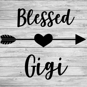 May include: Black and white wooden sign with the words "Blessed Gigi" in a cursive font. A black arrow with a heart in the center is between the words. The background is a light gray wood grain.