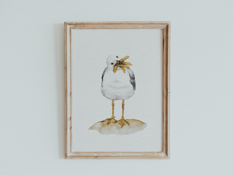 K&ouml;nnte beinhalten: Ein Aquarellbild einer M&ouml;we mit wei&szlig;em K&ouml;rper, schwarzen Fl&uuml;geln und gelbem Schnabel und Beinen. Die M&ouml;we steht auf einem kleinen Felsen mit offenem Schnabel, als w&uuml;rde sie etwas fressen wollen.