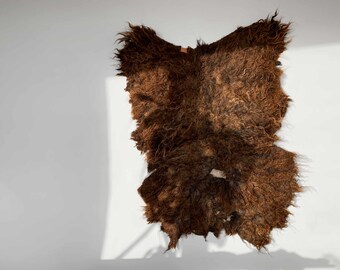 Sheepskin, unique color, brown black, handmade and animal friendly.