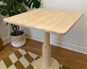 Square dining table with pedestal leg. handmade solid wood cafe table, natural, light , single leg, center support table.