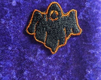 Black and orange ghost embroidered patch