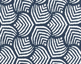 May include: A repeating pattern of white and navy blue geometric shapes. The shapes resemble stylized, segmented hexagons with a textured, ikat-like appearance. The design is symmetrical and creates a visually dynamic surface.