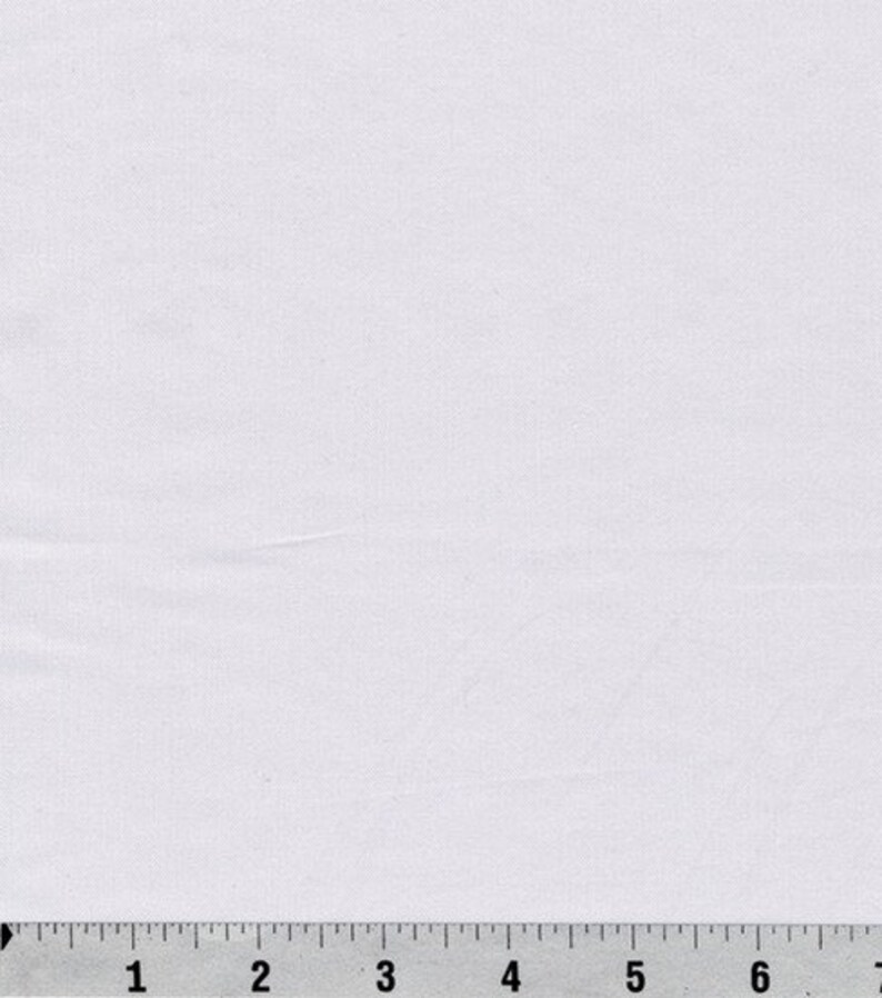 May include: A plain white fabric swatch with a ruler measuring 7 inches.