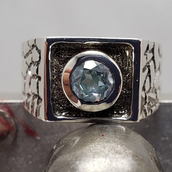 Sterling silver, baroque Signet ring, synthetic aquamarine bezel stone set, patina  background blackened, stock size 9.5, sizable, new