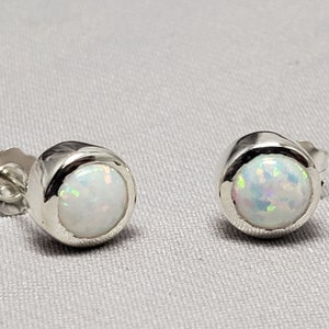 Sterling silver earrings, synthetic opal, white ,bezel stone set, push back system,  brand new,  hand set, nice style